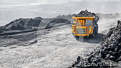 Open pit mine industry, big yellow mining truck for coal anthracite Stock Photo