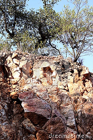 Open pit opal mining in Tequisquiapan Queretaro, Mexico is a natural wonder of towering orange rock formations Stock Photo