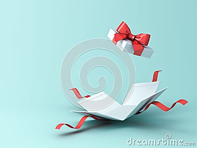 Open present box or gift box with red ribbons and bow isolated on green blue pastel color background Stock Photo