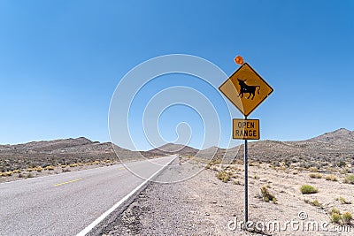 Open Range road sign warning drivers of cattle and cows near the highway Stock Photo