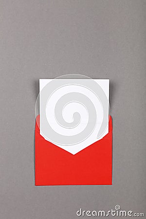 Open red paper envelope over grey Stock Photo