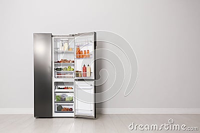 Open refrigerator filled with food, space for text Stock Photo