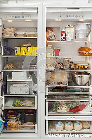 Open Refrigerator With Food Items Stock Photo