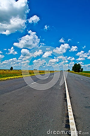 Open road beneath a brilliant blue African sky Stock Photo