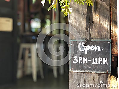 Open Sign , Notice about time for Open 3 PM to 11 PM Written In Chalk Stock Photo