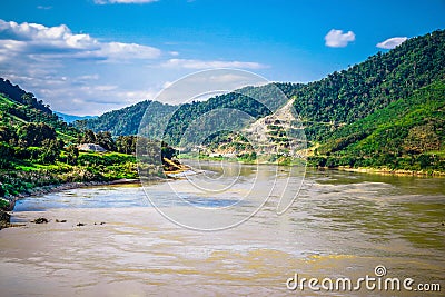 Open sky and foresty mountain below Stock Photo