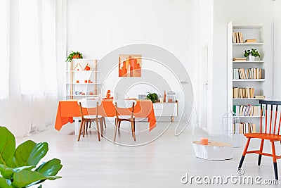 White and orange colored living room interior in modern home. Stock Photo