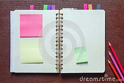 Open spiral bound notebook with blank pages and post-it notes. Copy space Stock Photo