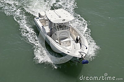 An Open Sport Fishing Boat Powered by a Single Outboard Engine Editorial Stock Photo