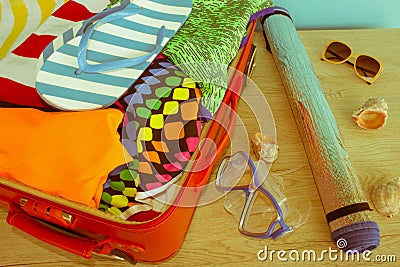 Open suitcase with different things. Travel concept. Open traveler`s bag with clothing, accessories Stock Photo