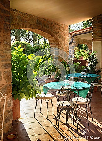 Open terrace cafe in italian village, Italy Stock Photo