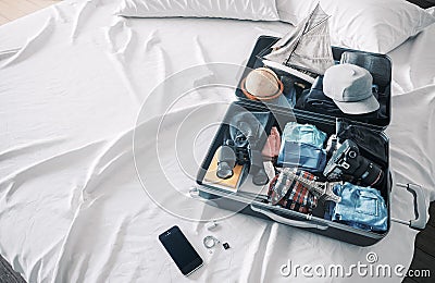 Open travel case in hotel bedroom travel vacation concept background Stock Photo