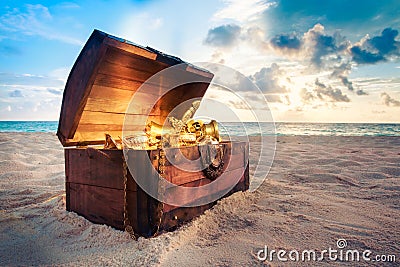 Open treasure chest on the beach Stock Photo