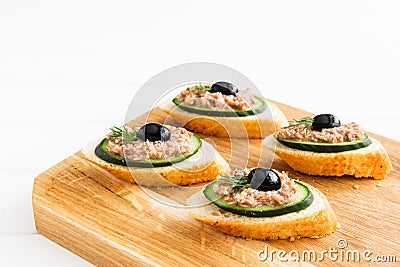 Open tuna sandwiches with cucumber point of view Stock Photo