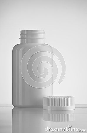 Open white medicine bottle Stock Photo