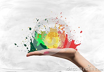 Open woman palm with splatters Stock Photo