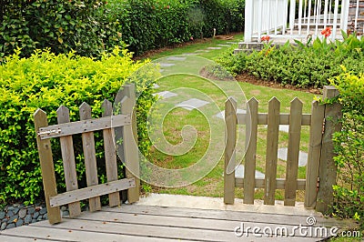 Open wooden gate and fence Stock Photo