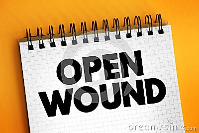 Open Wound - injuries that involve a break in the skin and leave the internal tissue exposed, text concept on notepad Stock Photo