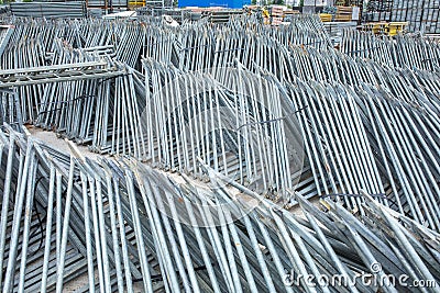 Openair storage of galvanized steel and aluminum frames, ladders, and ringlock scaffolding systems for many applications on Stock Photo