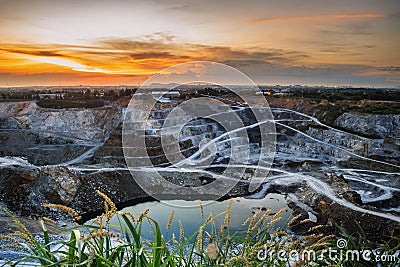 Opencast mining quarry with beautiful sunlight and cloudy sky Aerial view industrial Stock Photo