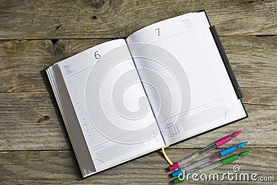 Opened agenda as copy space or background on wooden table Stock Photo