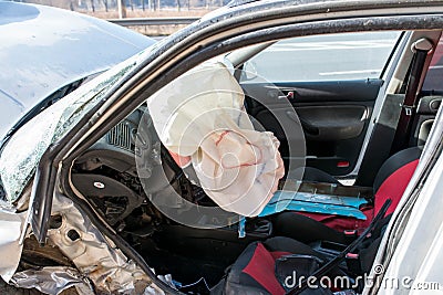 Opened airbag on Volkswagen Golf after side collision. Editorial Stock Photo