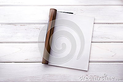 The Opened empty white mock up magazine page on white wooden tab Stock Photo