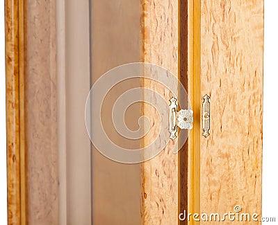 Opened golden castle with an ornament on a wooden frame with glass Stock Photo