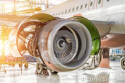 Opened hood aircraft engine jet under maintenance in the hangar Stock Photo