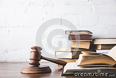 opened juridical books with gavel on wooden table, Stock Photo