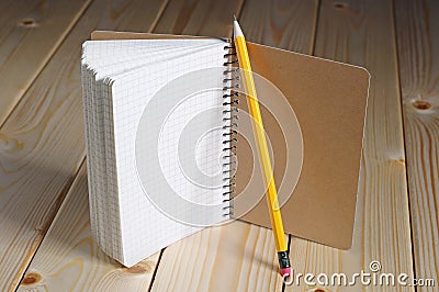 Opened notepad and pencil Stock Photo