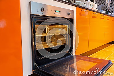 Opened oven in the kitchen Stock Photo