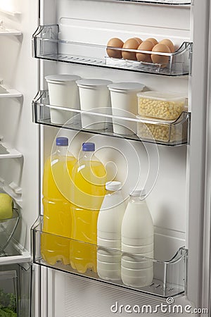 Opened refrigerator full of foodstuff Stock Photo