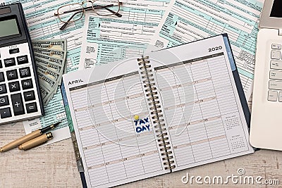 Opened schedule with note on April 15th. Tax day, deadline Editorial Stock Photo