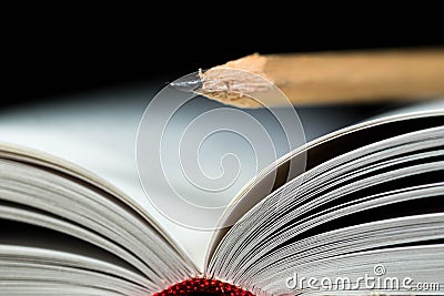 Opened white book pages close up macro shot with a pencil on it Stock Photo