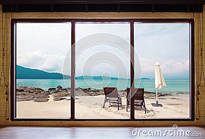 Opened window seeing tropical beach view in summer holiday at weekend house and resort Stock Photo