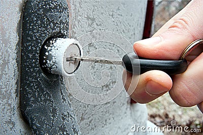 Opening frozen car lock Stock Photo