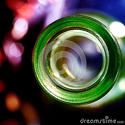 Opening of glass bottle from above with bokeh background, empty bottle concept, drinking, alcohol Stock Photo