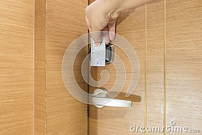 Opening a hotel door with keyless entry card Stock Photo