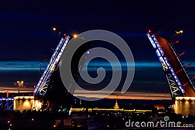 Opening of Palace drawbridge. Night view of Palace bridge from the Neva river in Saint Petersburg, Russia Editorial Stock Photo