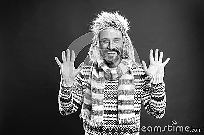 Openness and honesty. Bearded man accessorizing sweater with hat and scarf. Mature fashion model in cold weather style Stock Photo