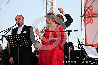 Opera Duo italian opera star aldo caputo , tenor, and daniela schillaci ( la scala, italy ) soprano, on the open stage Editorial Stock Photo