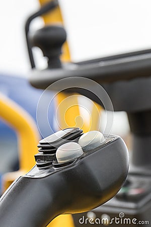 Operating control lever and steering wheel in truck, forklift or other industrial machine Stock Photo