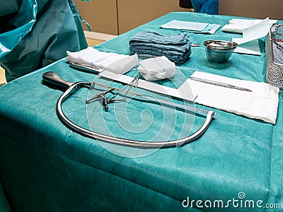 on the operating table are the instruments for performing a leg amputation Stock Photo