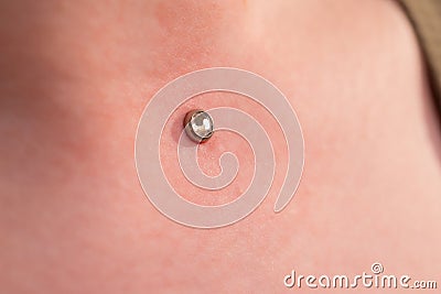 Operation to install microdermal piercing. Professional placing Stock Photo