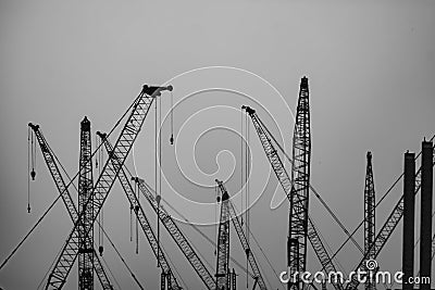 Under Construction - Several cranes at Work Stock Photo