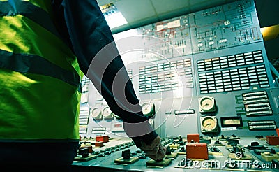 Operator hand on the control panel power plant Stock Photo