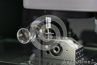 Operator inspection high precision part by CMM coordinate measuring machine Stock Photo