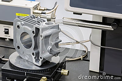 Operator inspection roughness on surface after machining Stock Photo