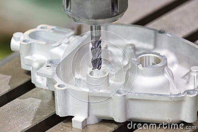 Operator milling automotive part by cabide endmill Stock Photo